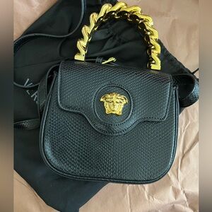 Small black and gold hand bag / crossbody very cute